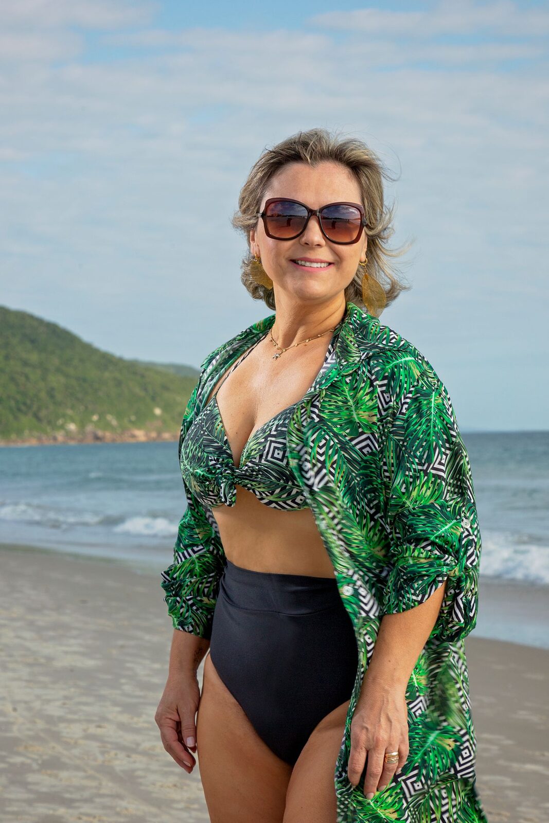 Woman wearing polarized sunglasses outdoors in bright sunlight